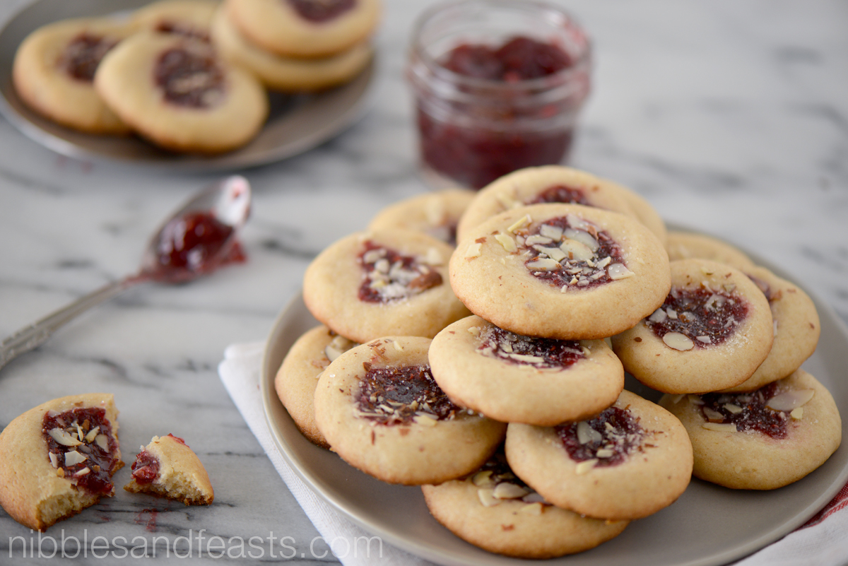 Raspberry Almond Thumbprint Cookies - Nibbles and Feasts