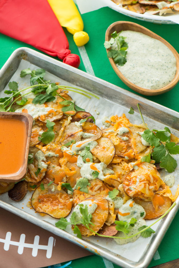 Cheesy Buffalo Potato Slices with Cilantro Cotija Cream Nibbles and