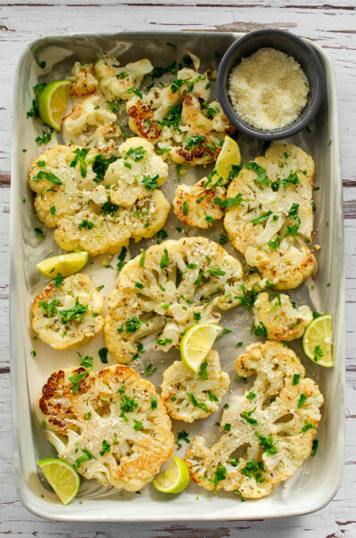 Roasted Cauliflower Steaks with Cotija - Nibbles and Feasts